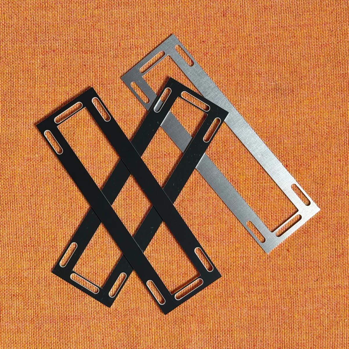 zudo-3u-to-1u panels assembled in a cross configuration (black and silver)